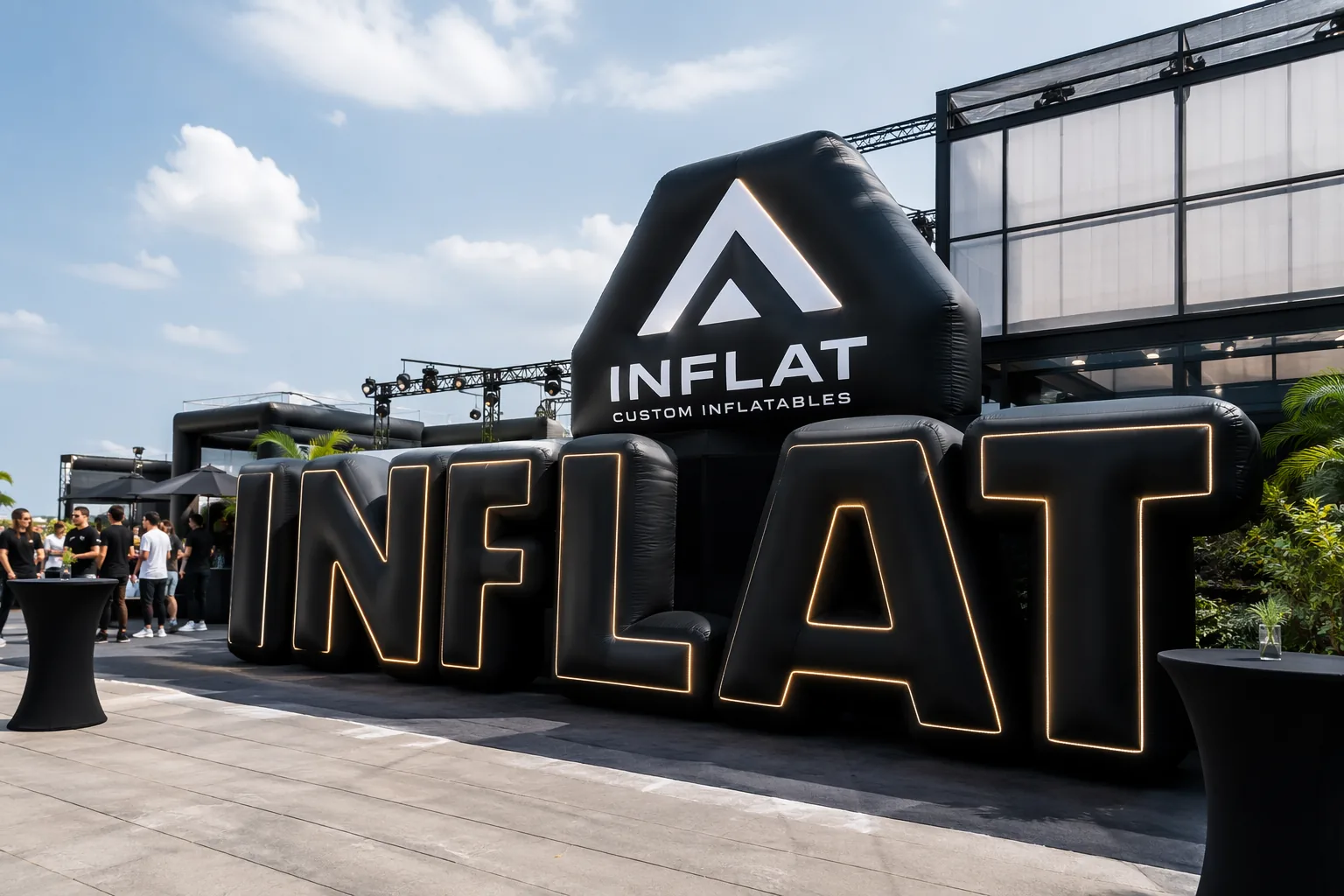 Outdoor event with custom inflatable letters and LED inflatable logo display