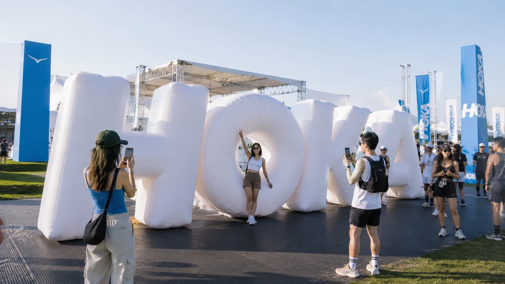 Giant custom inflatable letters at an outdoor brand activation event