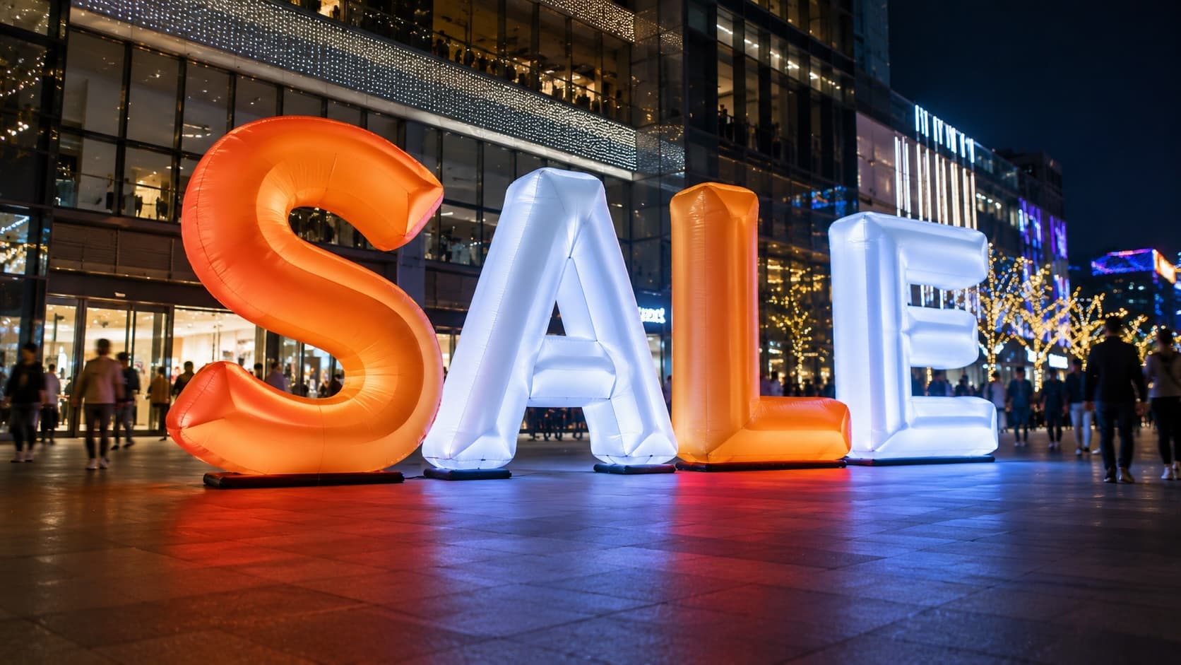 Illustrative inflatable retail lettering display; not a New Zealand customer installation