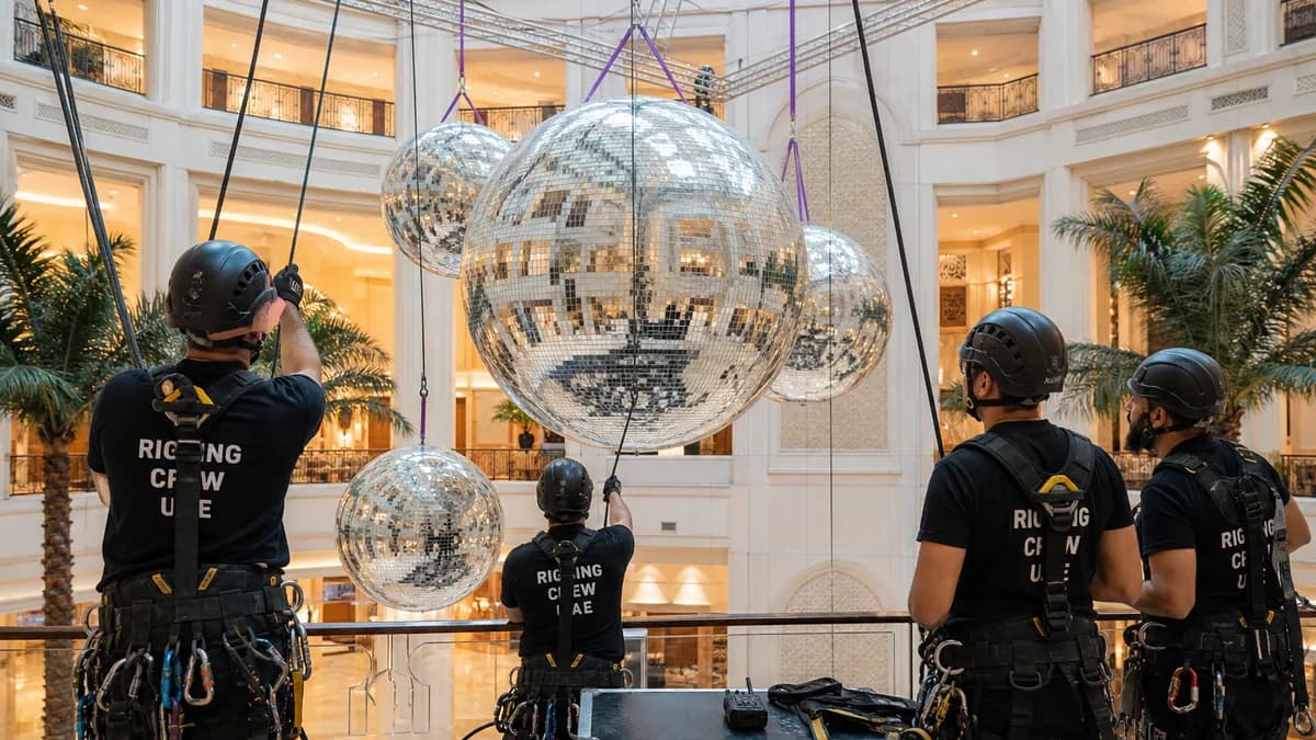 Event team preparing inflatable mirror balls for rigging and installation