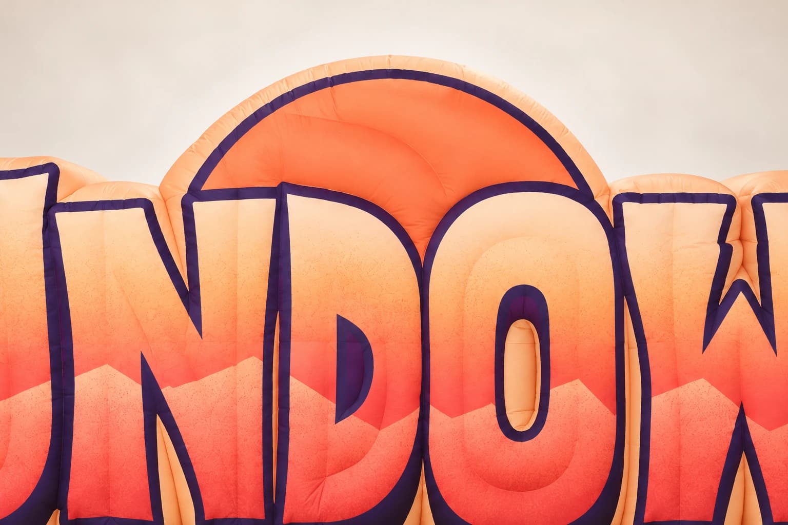 AI-assisted product visualization: Close-up of orange sun semicircle above central SUNDOWN letters