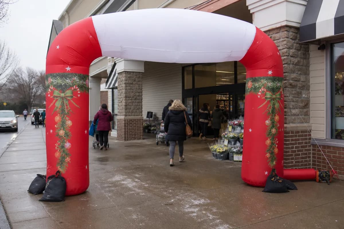 Inflatable Christmas arch for a store entrance with a clear pedestrian route