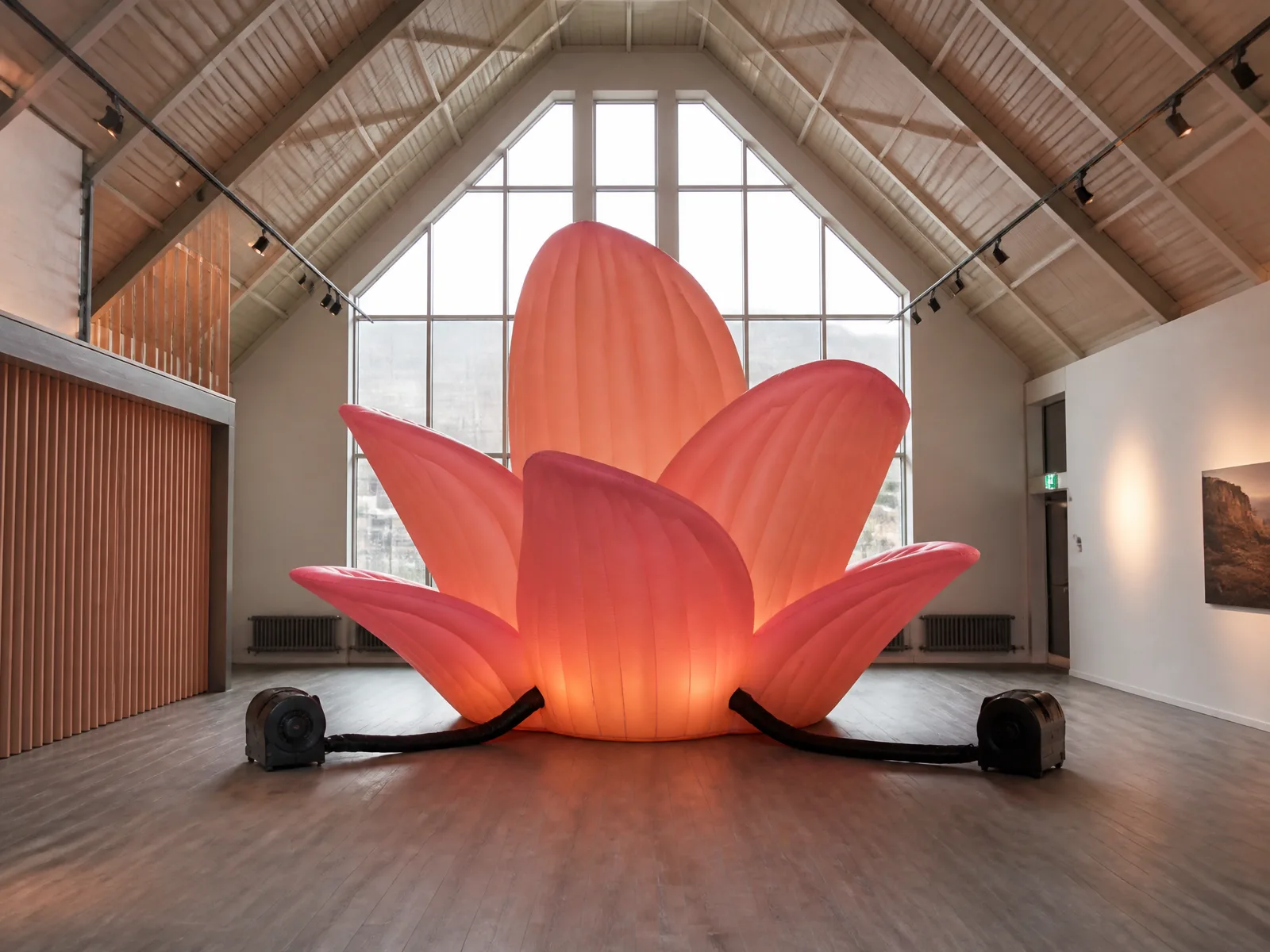 Installation of abstract flower inflatable sculpture showing scale and floor setup