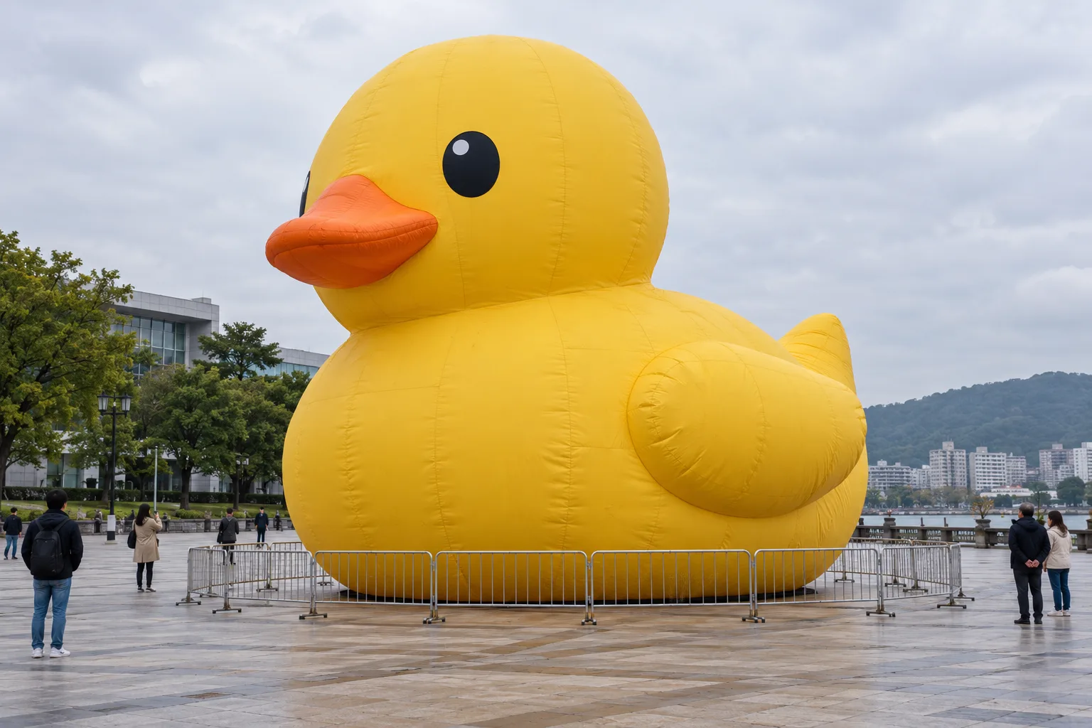 Planning illustration of an inflatable duck on a dry paved plaza.