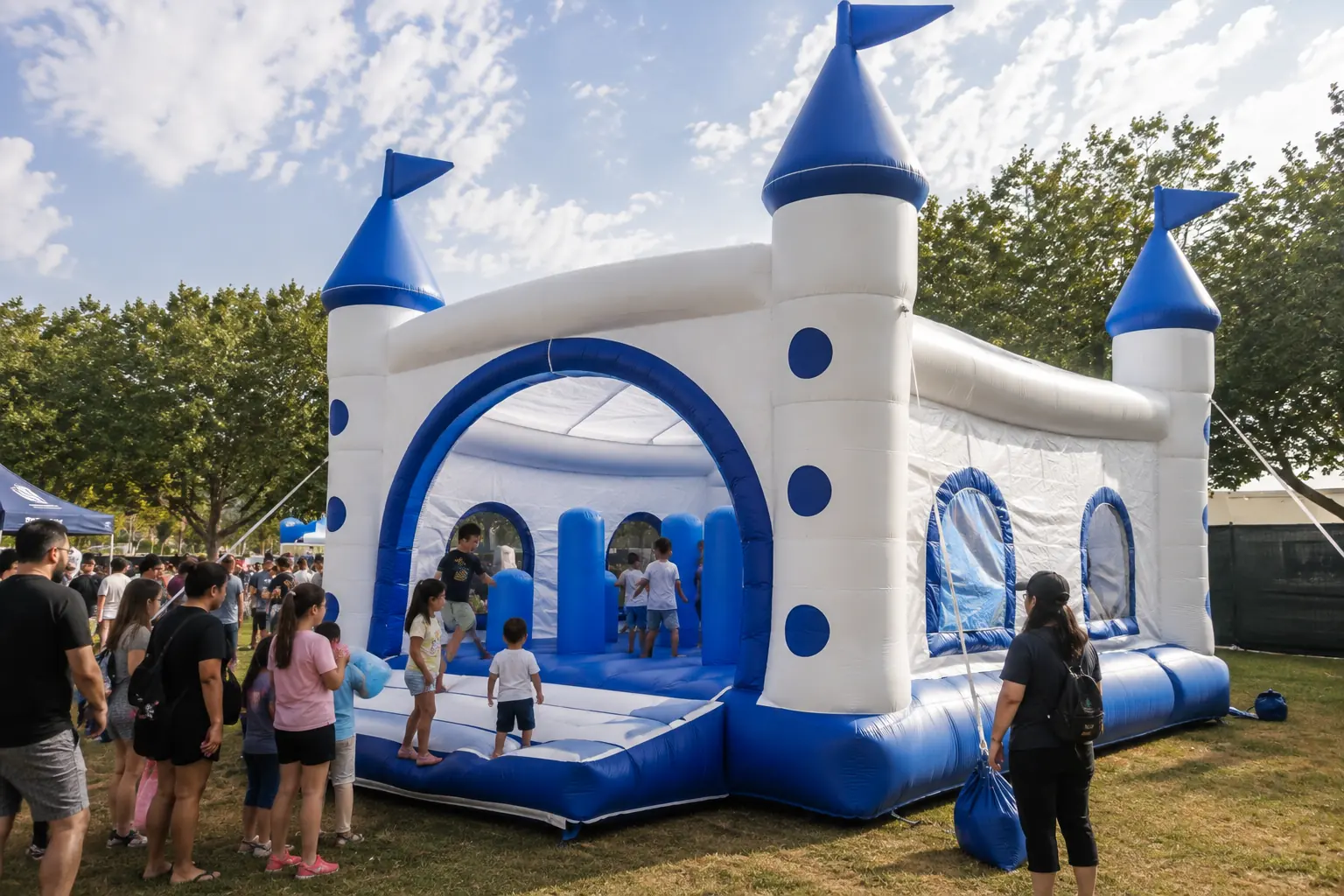 Blue and white inflatable castle tent used as outdoor event decor for family festival visitors