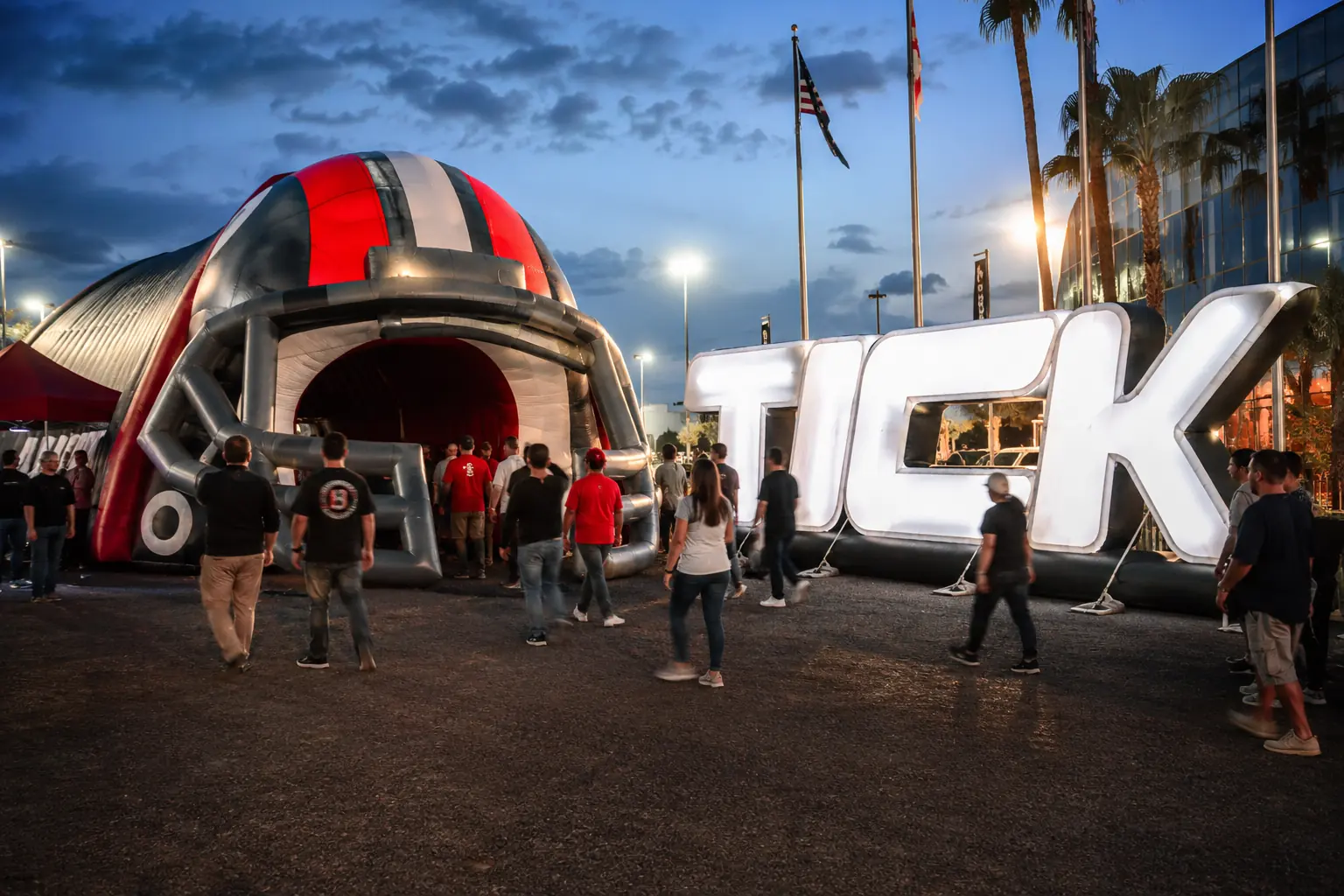 Inflatable event tunnel and giant illuminated inflatable letters used as an outdoor event entrance