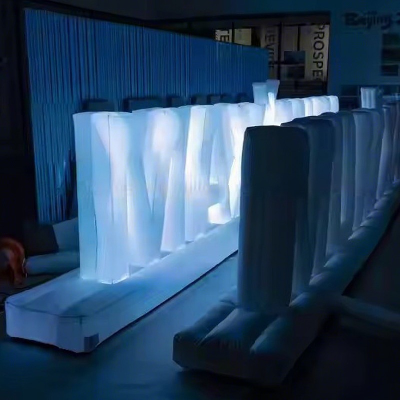 LED inflatable letters glowing at a branded event display